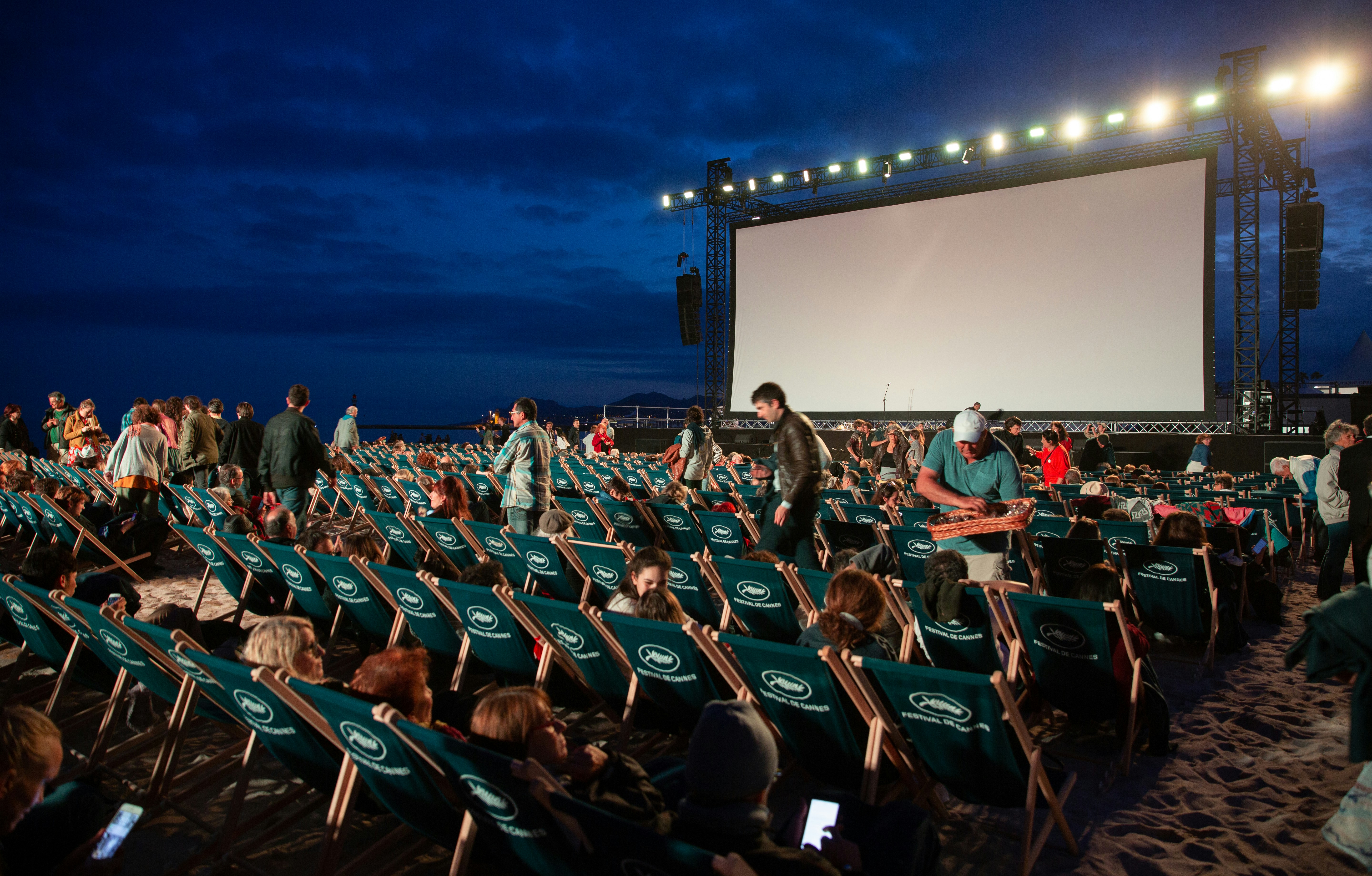 A group of people seated in a production screening or creative meeting setting